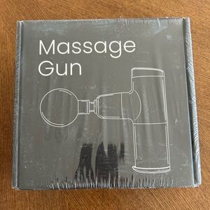 Massage gun - never opened. 4 interchangeable heads